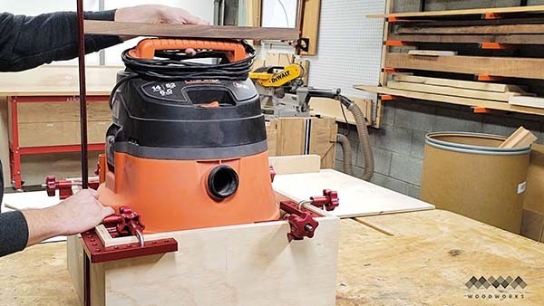 measuring the base of the dust collection cart