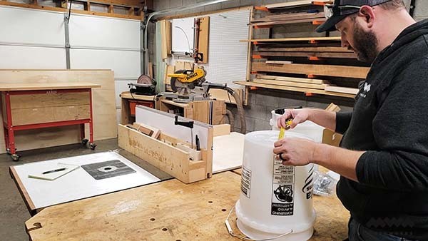 measuring the base of the dust collection cart