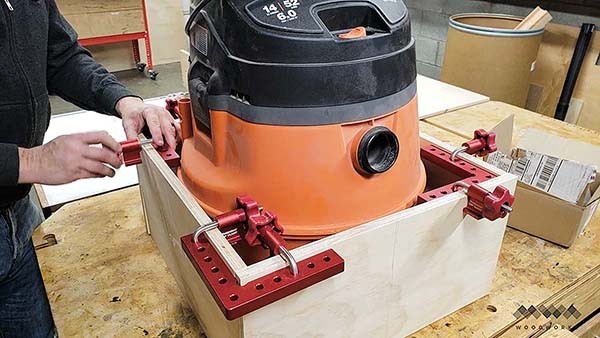 measuring the base of the dust collection cart