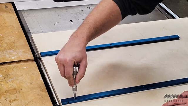 attaching the runners to the cross cut sled with a center punch